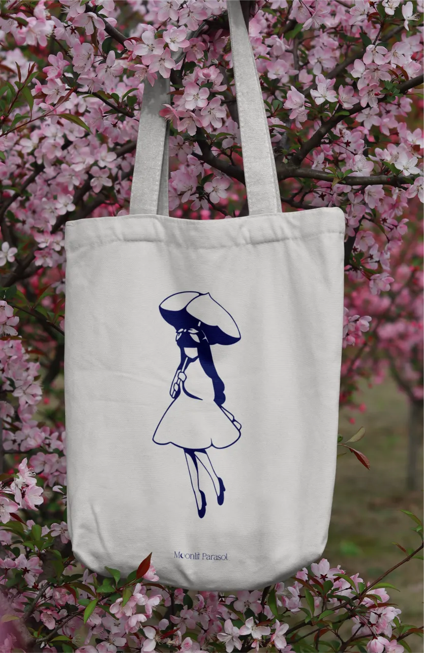 tote bag in sakura tree with girl pictorial logo