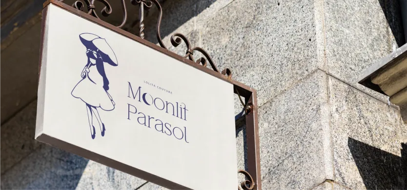store sign with moonlit parasol logo